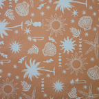 A close-up of a fabric pattern featuring white beach-themed illustrations, including palm trees, starfish, seashells, suns, and small leaves, printed on a warm peach-orange background.