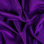 A close-up of draped purple fabric with a soft, slightly lustrous texture and folds filling the frame.