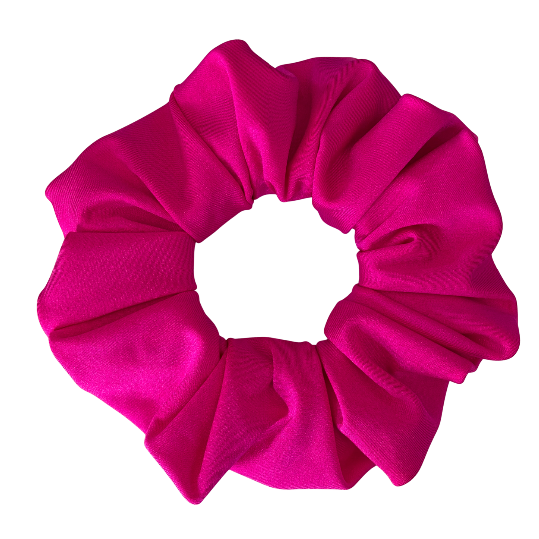 A bright hot pink satin hair scrunchie, photographed flat against a solid white background.