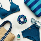 Blue swimwear set with accessories on a white background