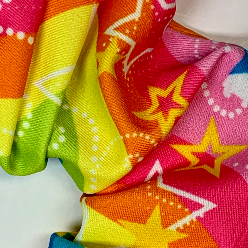 Close-up of colorful fabric with star patterns on a white background