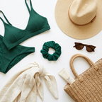 Green bikini set with accessories including a hat, scrunchie, sunglasses, and bag on a white background