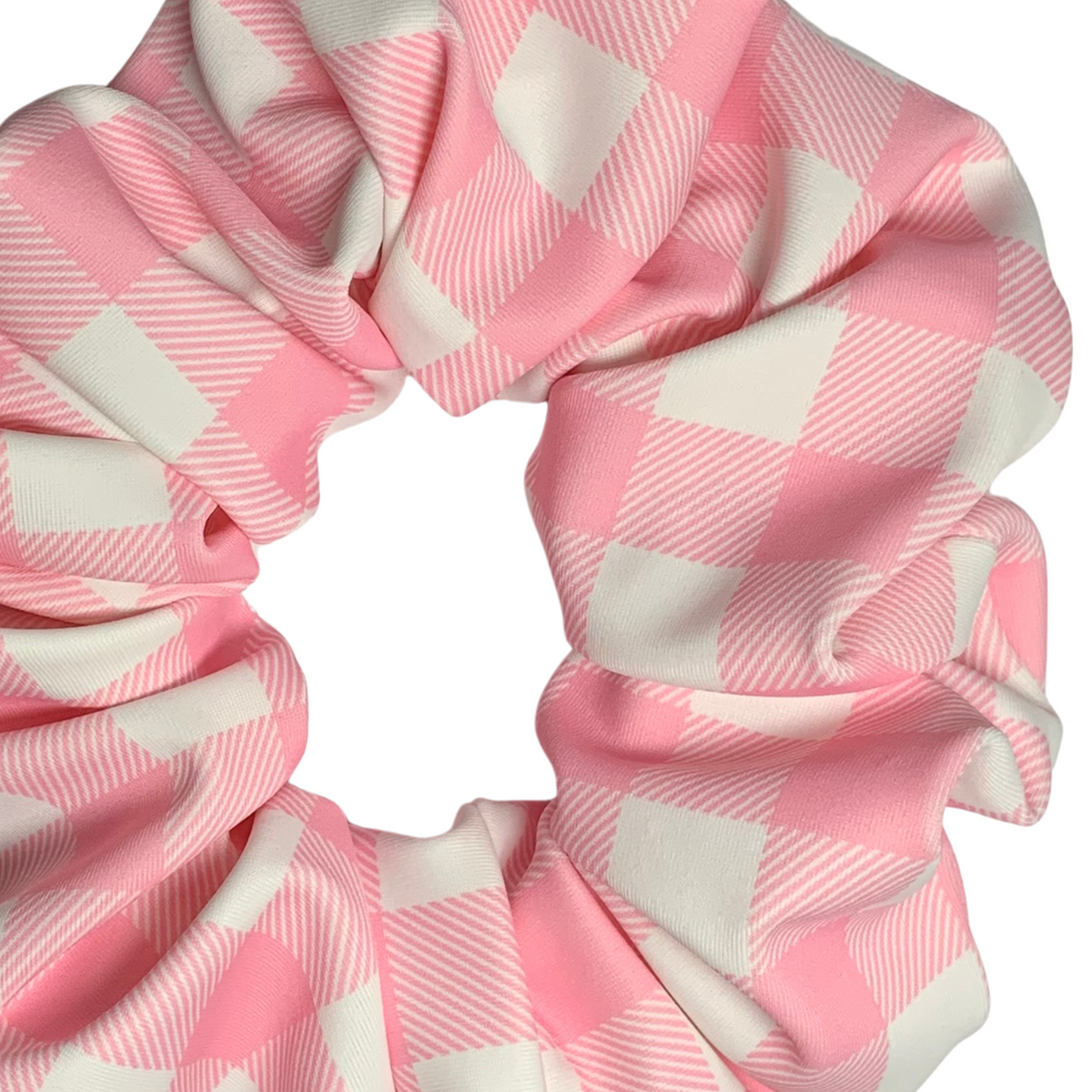 Pink and white checkered swim scrunchie on a white background
