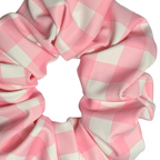Pink and white checkered swim scrunchie on a white background
