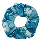 Blue and white patterned scrunchie on a white background