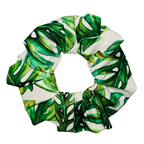 Green leaf-patterned scrunchie on a white background