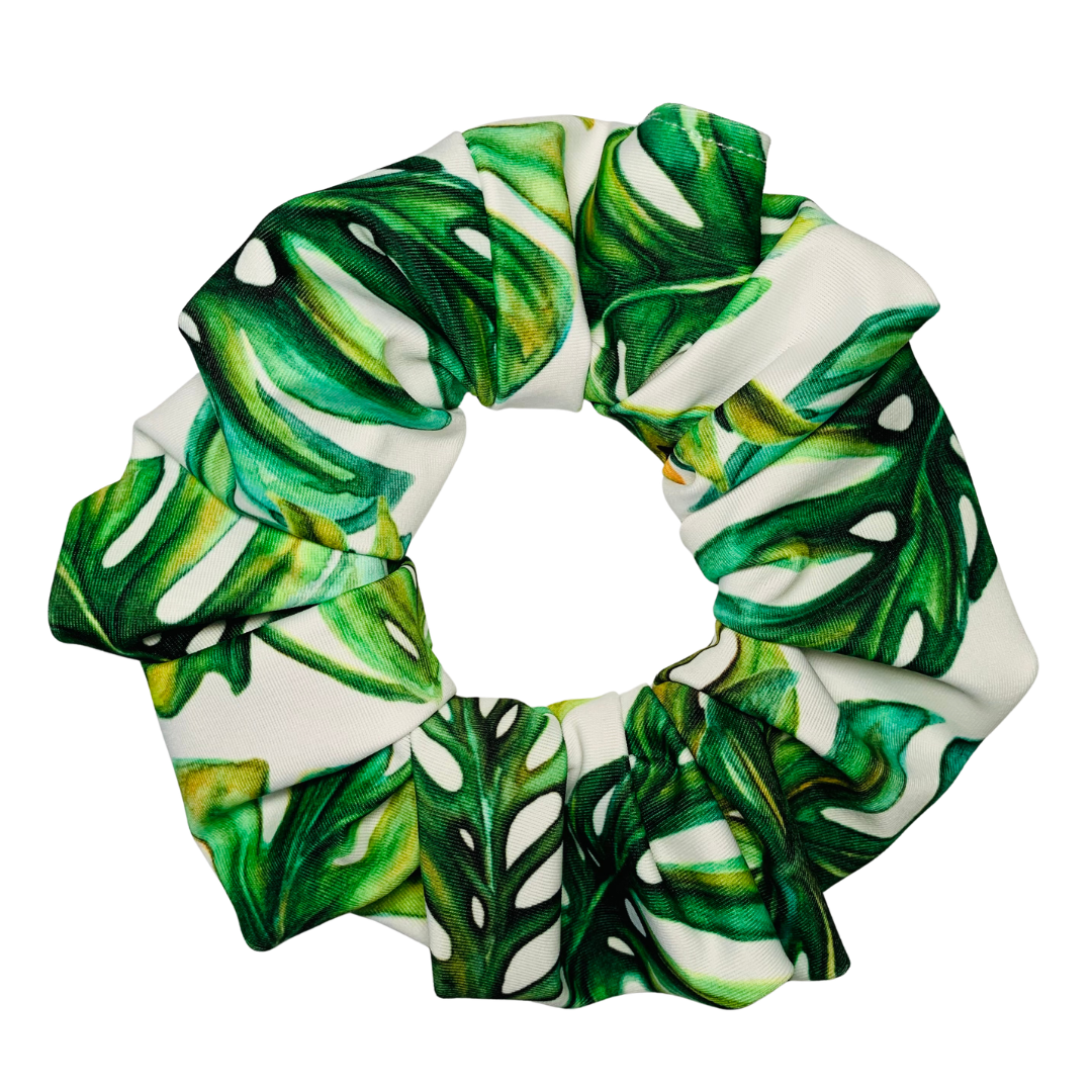 Green leaf-patterned scrunchie on a white background