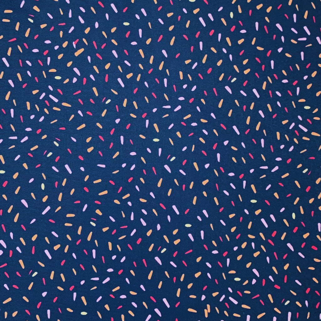 Colorful sprinkles pattern on a blue background