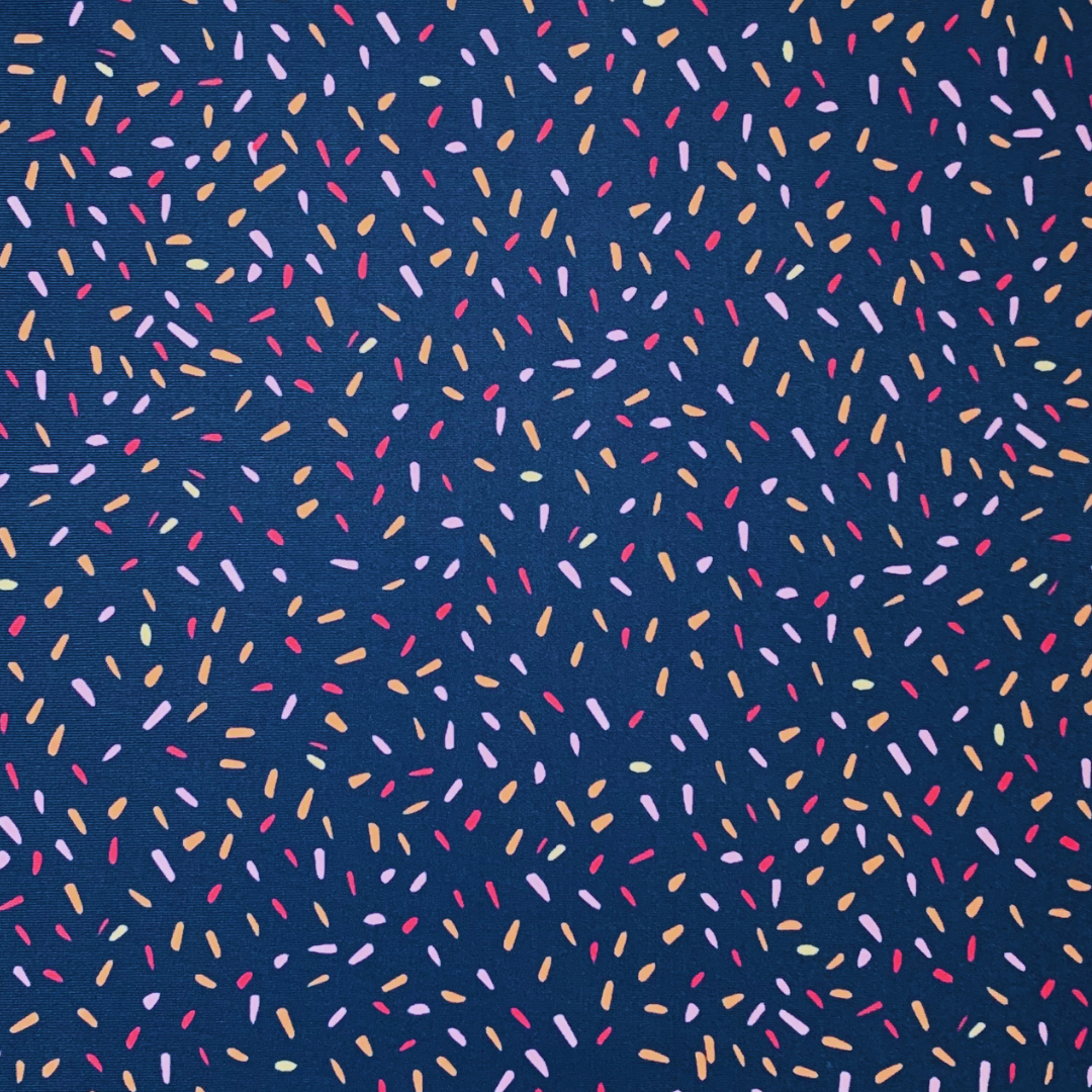 Colorful sprinkles pattern on a blue background