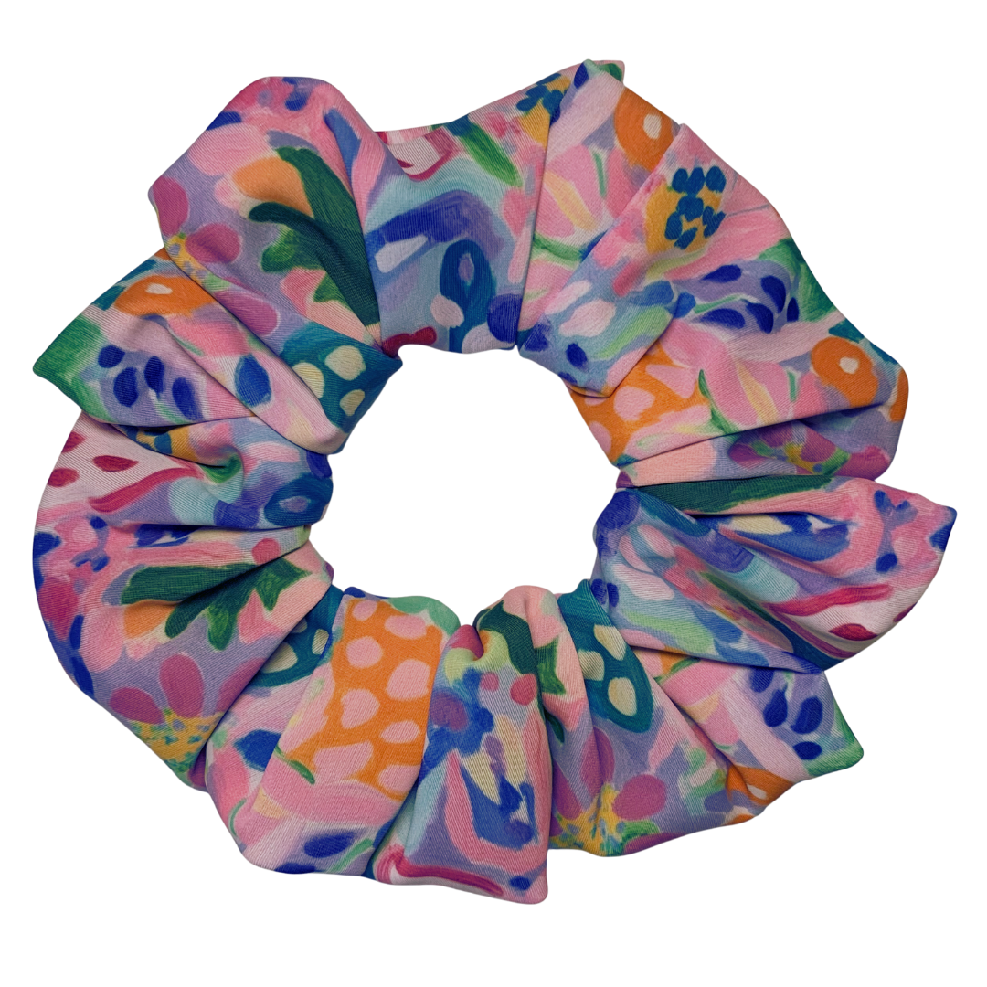 Colourful floral patterned swim scrunchie on a white background
