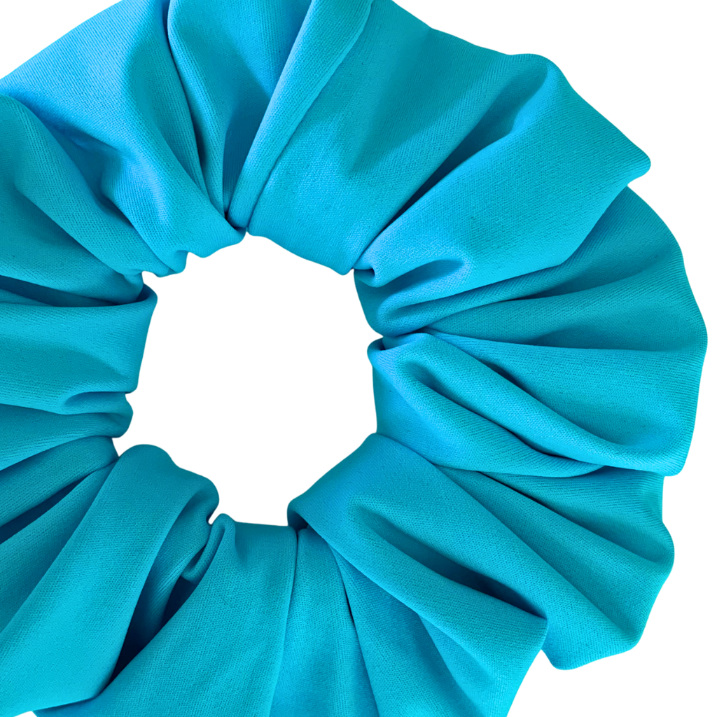 Close-up of a aqua scrunchie on a white background