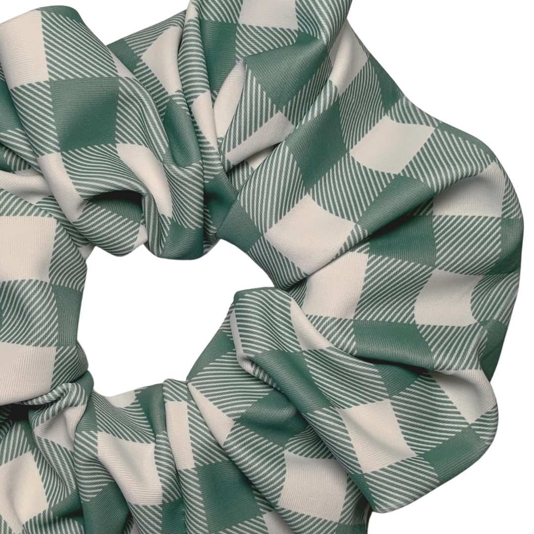 Green and white checkered swim scrunchie on a white background