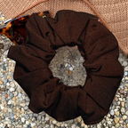 Chocolate Swim Scrunchie sitting on hat and sunglasses