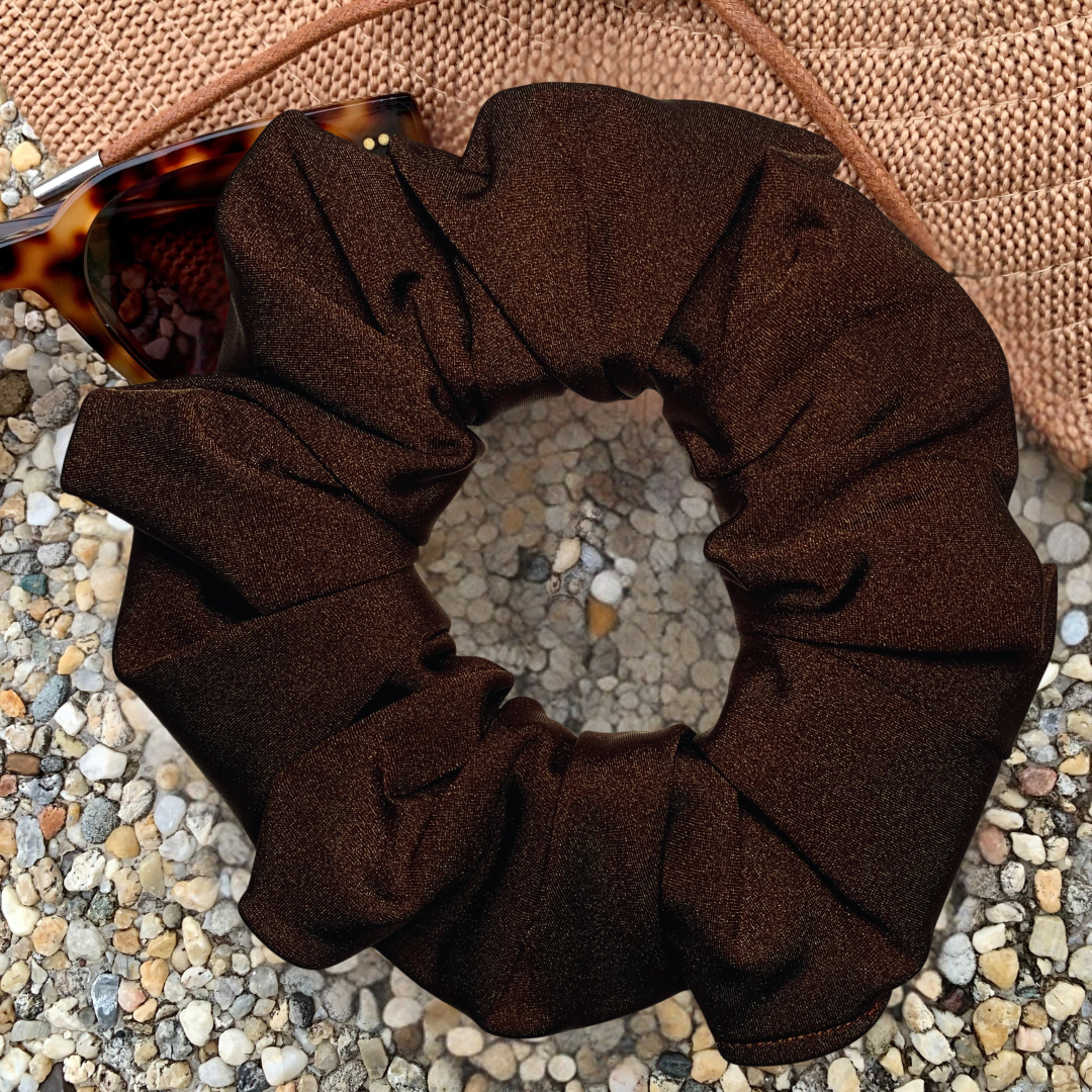 Chocolate Swim Scrunchie sitting on hat and sunglasses