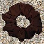 Chocolate Swim Scrunchie on a pebble background
