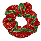 Red and green patterned scrunchie on a white background