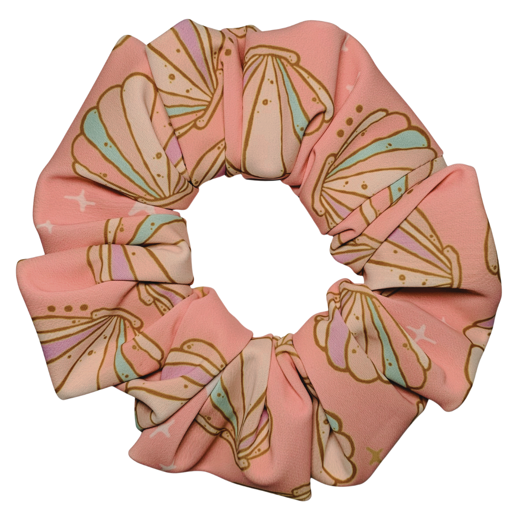 Pink seashell swim scrunchie on a white background