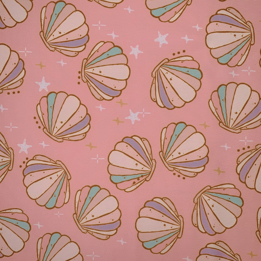 Pattern of colorful seashells on a pink background