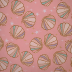 Pattern of colorful seashells on a pink background