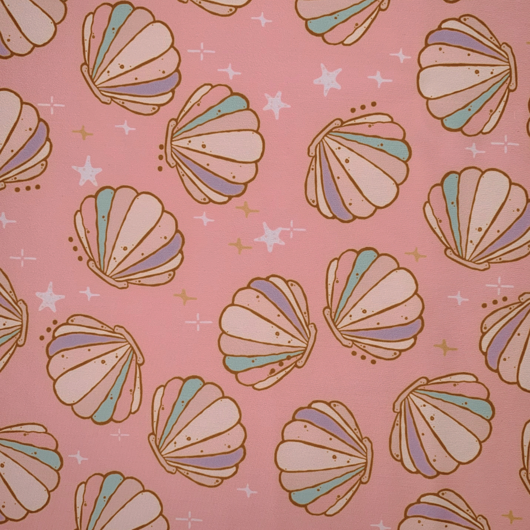 Pattern of colorful seashells on a pink background