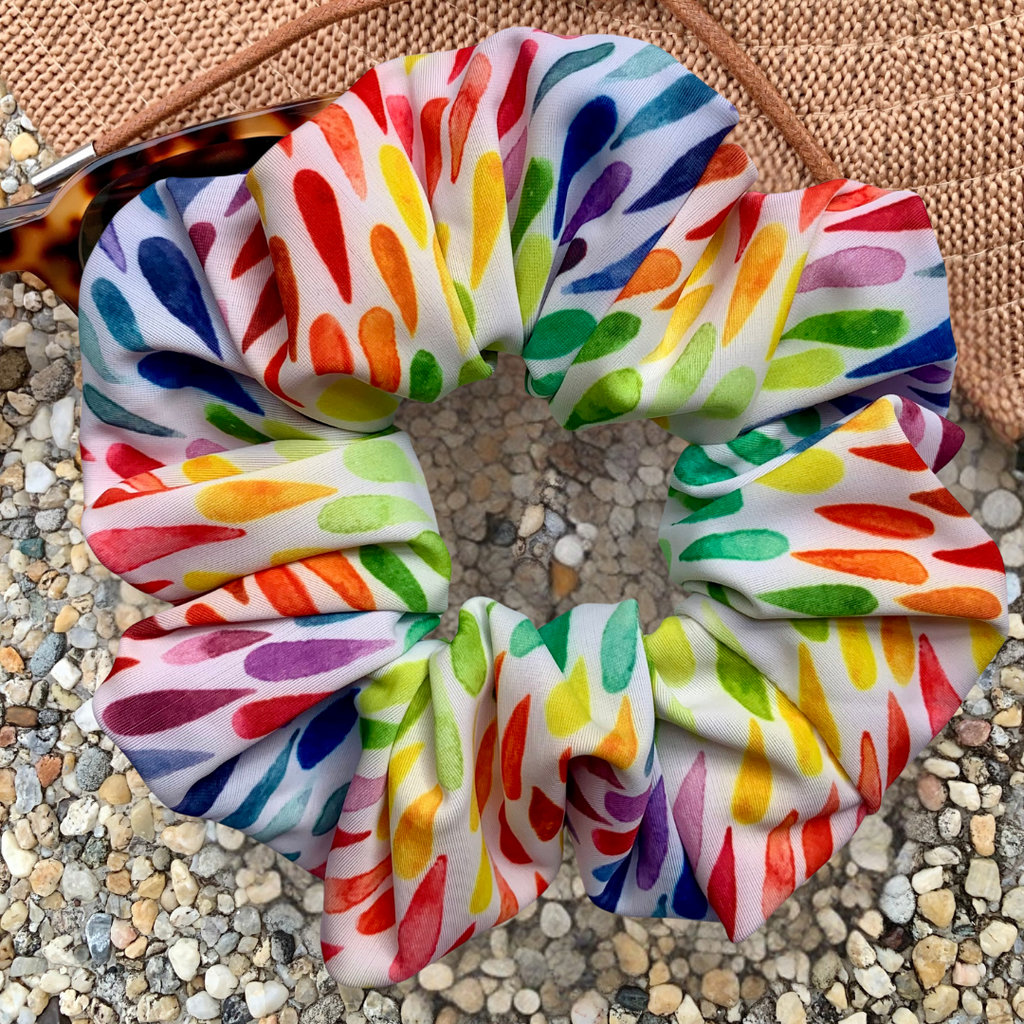 Colourful swim scrunchie on a textured surface