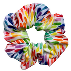 Colourful swim scrunchie with abstract pattern on a white background