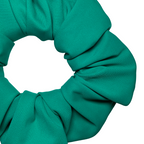 Close-up of a green swim scrunchie on a white background