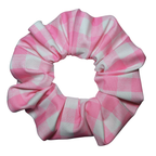 Pink and white checkered scrunchie on a white background