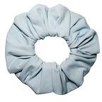 A single light blue fabric scrunchie photographed on a plain white background.