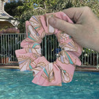 Swim scrunchie being dipped into pool water