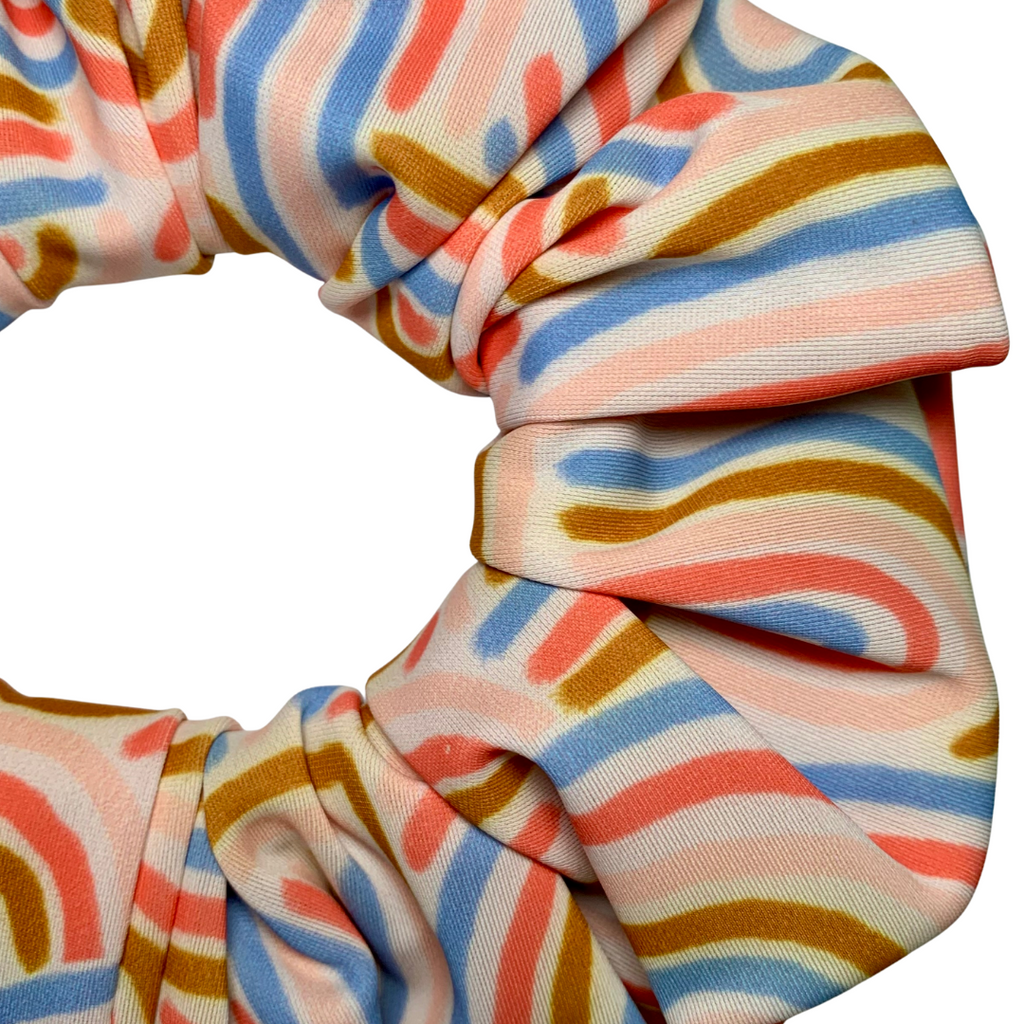 Colourful striped scrunchie on a white background