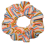 Colourful scrunchie with abstract pattern on a white background