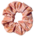 Pink swim scrunchie with shell pattern on a white background