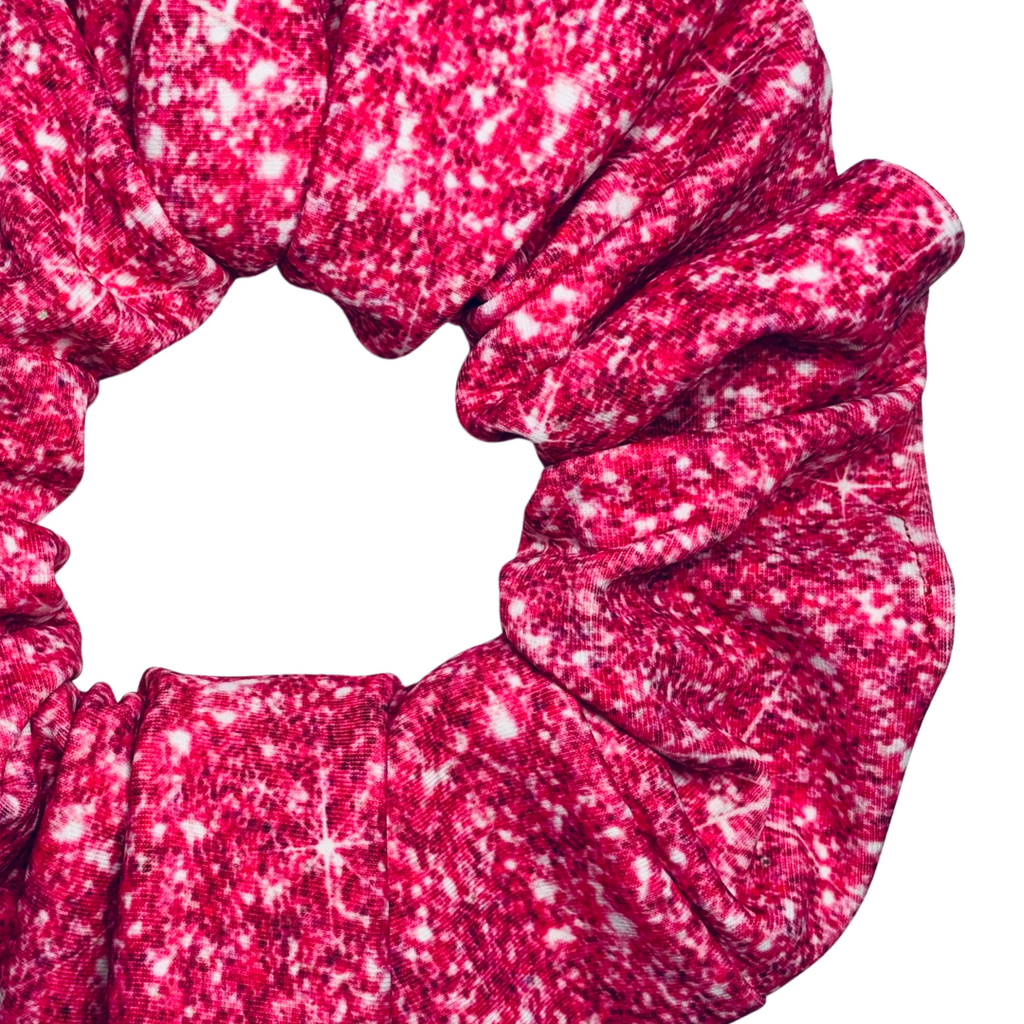 Pink printed sparkle swim scrunchie on a white background