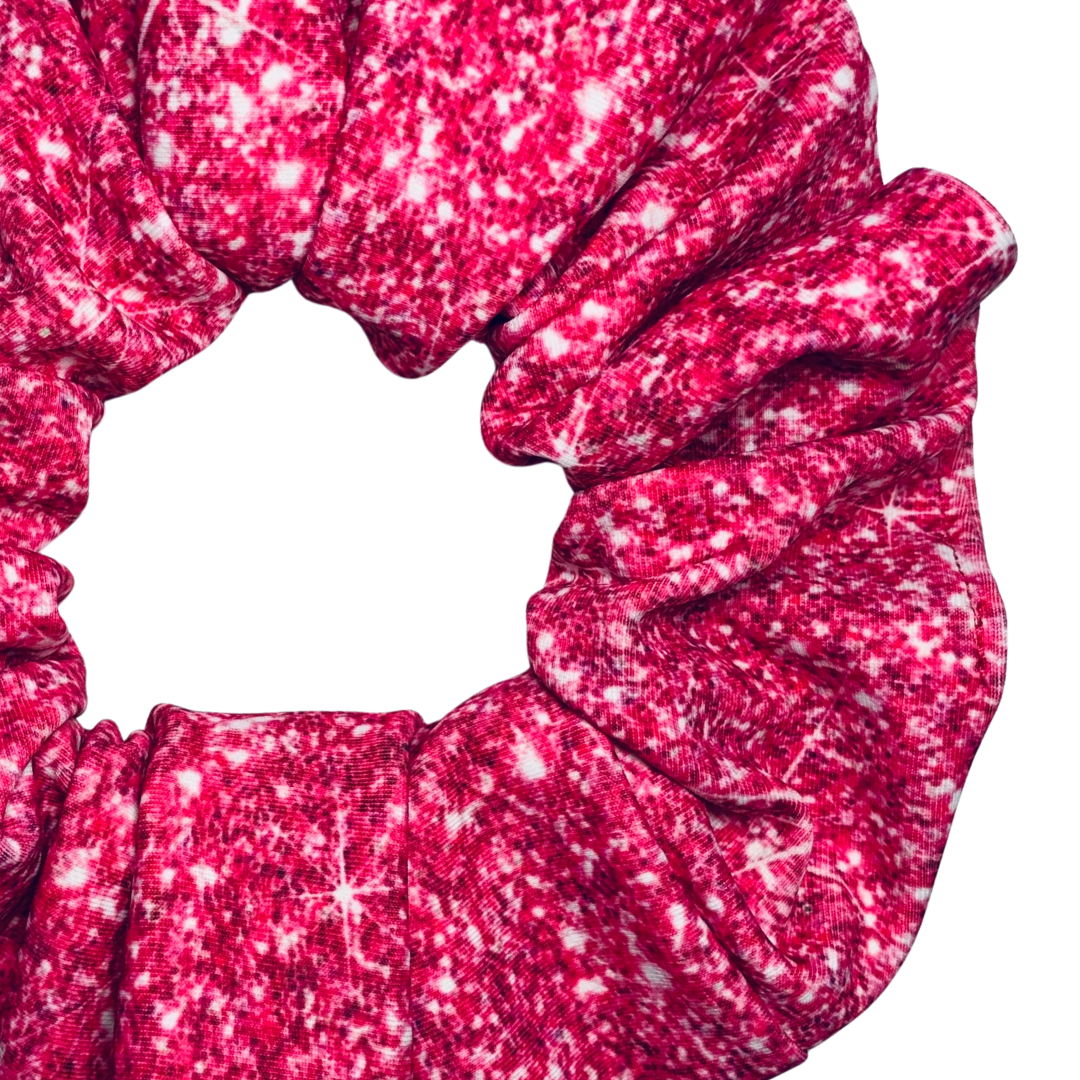 Pink printed sparkle swim scrunchie on a white background