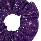 Close up of a Purple printed sparkle swim scrunchie  a white background
