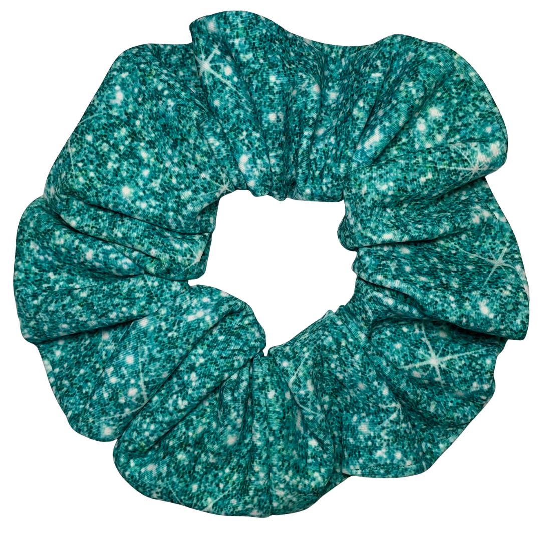 Teal printed sparkle swim scrunchie on a white background
