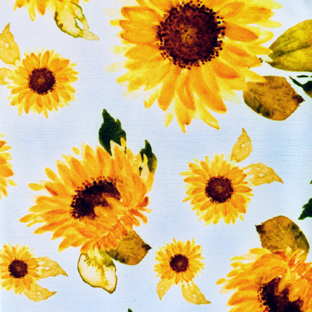 Pattern of yellow sunflowers with a white background